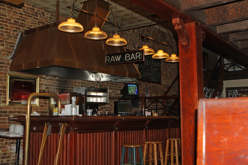 Raw bar - we're the first customers (wish the neon light was on)