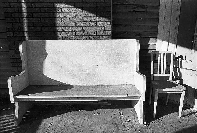 Laurel and Hardy chair, porch, Ithaca, NY