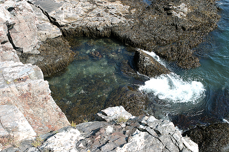 The water goes into a cave on the left