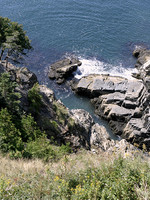 Peering down cliff, south end of Mount Desert Island