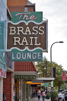 The Brass Rail - old sign on a still somewhat vibrant street
